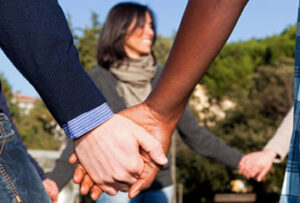 Multicultural people holding hands